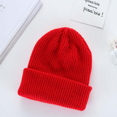 Stylish red knit cap made from wool, perfect for curling enthusiasts. BONEHEAD PRO-CREATIONS fashion hat.