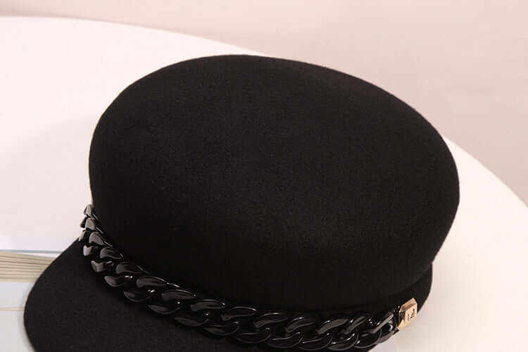 Black high-end wool baseball cap for women by BONEHEAD PRO-CREATIONS featuring a wide brim and stylish chain detail.