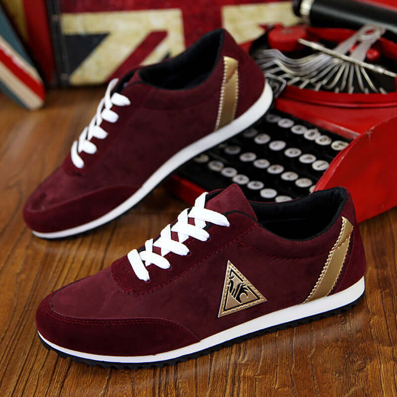 Rooster shoes in burgundy with white laces, featuring gold accents, perfect for casual wear and stylish comfort.