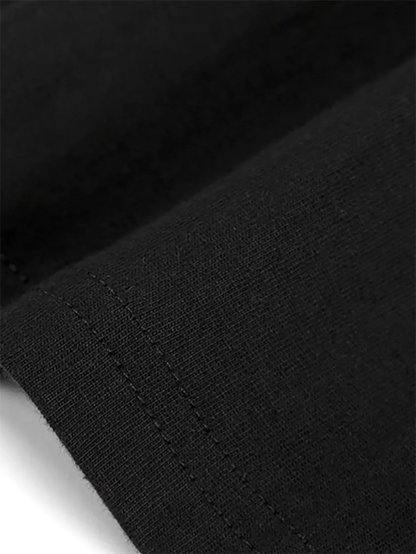 Close-up of the fabric texture and stitching of the Cotton Flag Print Tee by BONEHEAD PRO-CREATIONS.