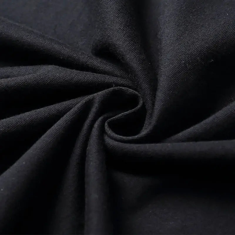 Close-up of soft black cotton fabric, showing the knit texture perfect for casual tees like AEW ALL IN T-shirt.