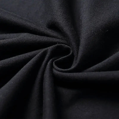 Close-up of soft black cotton fabric, showing the knit texture perfect for casual tees like AEW ALL IN T-shirt.