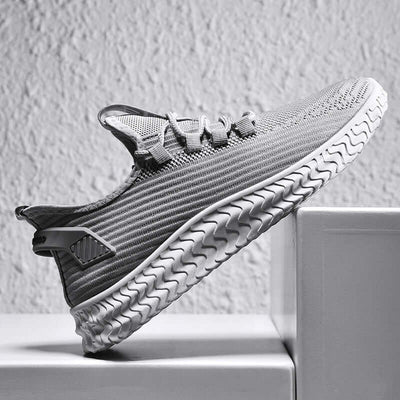 Stylish men's casual shoes by BONEHEAD PRO-CREATIONS, breathable flying weave design in gray with flat rubber sole.