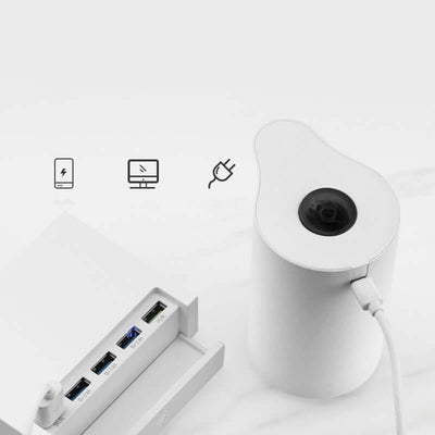 White electric water pump USB powered, designed for easy bottled water dispensing.