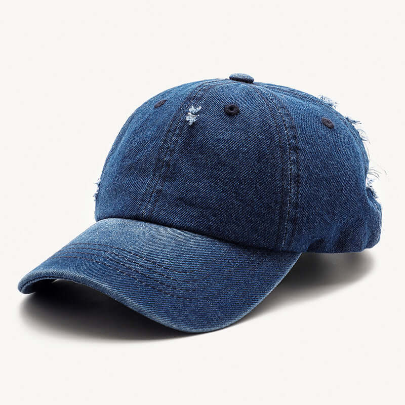 Distressed denim baseball cap in dark blue by BONEHEAD PRO-CREATIONS, adjustable fit for all seasons.