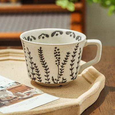 Hand-painted minimalist Nordic ceramic mug with floral design, perfect for modern home decor.