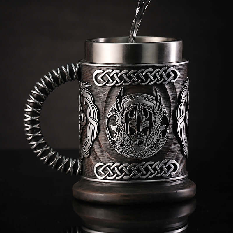 God of War themed minimalist beer mug with intricate silver detailing and woven handle. Perfect for retro style enthusiasts.