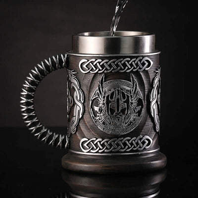 God of War themed minimalist beer mug with intricate silver detailing and woven handle. Perfect for retro style enthusiasts.