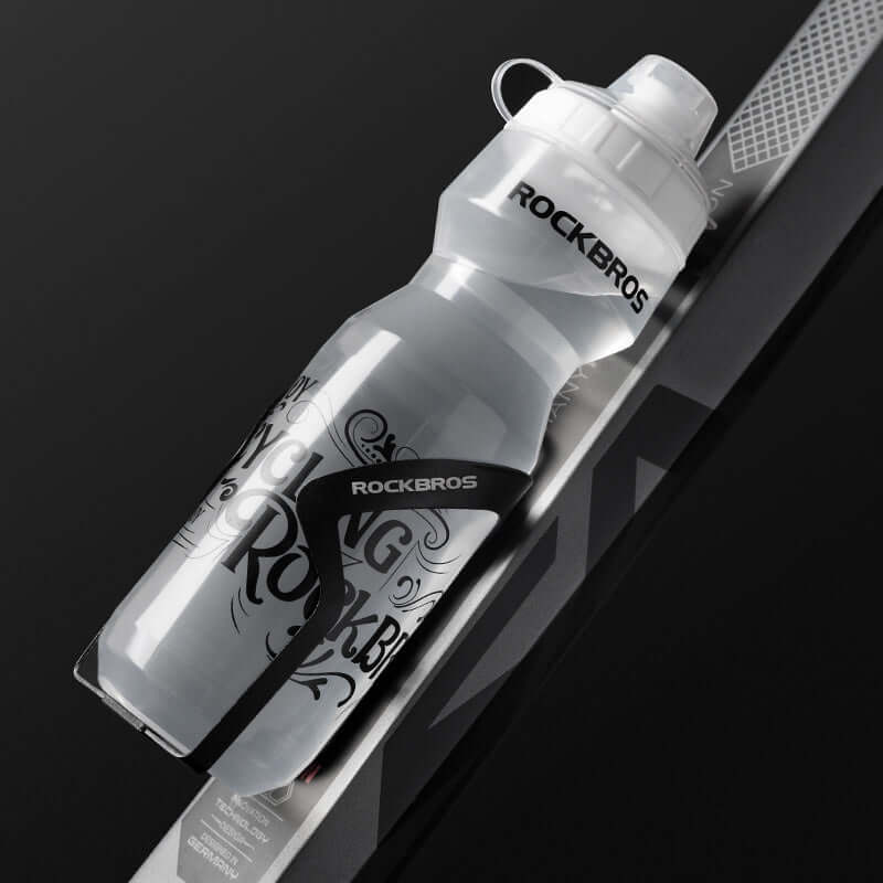 Cycling water bottle by RockBros on a bike, featuring a transparent design and press-type water outlet.