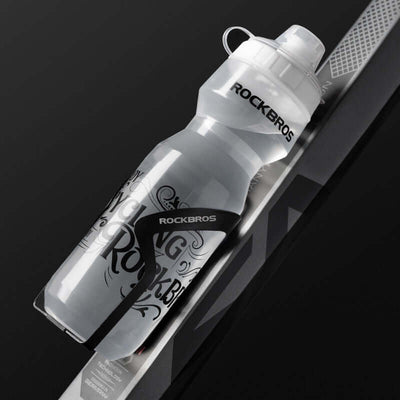 Cycling water bottle by RockBros on a bike, featuring a transparent design and press-type water outlet.